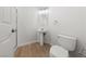 Contemporary bathroom features a pedestal sink and a walk-in shower at 10617 Tuckermans Ave, Las Vegas, NV 89129