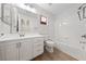 Bright bathroom features a white vanity with tub and shower combination at 10617 Tuckermans Ave, Las Vegas, NV 89129