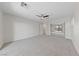 Spacious bedroom with new carpet and a ceiling fan at 10617 Tuckermans Ave, Las Vegas, NV 89129
