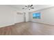Bright and airy bedroom with wood floors and large windows at 10617 Tuckermans Ave, Las Vegas, NV 89129