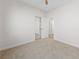 Neutral bedroom featuring carpet and a closet and doorway to other rooms at 10617 Tuckermans Ave, Las Vegas, NV 89129