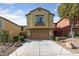 Inviting two-story home with a well-maintained front yard and a two-car garage at 10617 Tuckermans Ave, Las Vegas, NV 89129