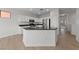 Modern kitchen with white cabinetry, stainless steel appliances, and an island at 10617 Tuckermans Ave, Las Vegas, NV 89129