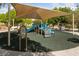 Community playground with shade and play equipment for children at 10617 Tuckermans Ave, Las Vegas, NV 89129