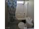 A cozy bathroom featuring a shower-tub combo and a toilet at 1144 Black Cherry St, Las Vegas, NV 89142