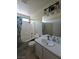Neutral bathroom featuring a shower-tub combo with white vanity at 1144 Black Cherry St, Las Vegas, NV 89142