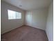 This bedroom has carpet and a window at 1144 Black Cherry St, Las Vegas, NV 89142