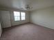 This bedroom offers two windows and carpet at 1144 Black Cherry St, Las Vegas, NV 89142