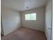 This bedroom has carpet and a window at 1144 Black Cherry St, Las Vegas, NV 89142