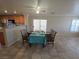 Dining area features tile flooring, set table, and sliding glass door leading to outdoor space at 1144 Black Cherry St, Las Vegas, NV 89142