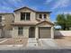 Charming two-story home with a red tile roof and low maintenance desert landscaping at 1144 Black Cherry St, Las Vegas, NV 89142