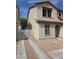 Two-story home featuring neutral stucco, a red tile roof, and a one-car garage at 1144 Black Cherry St, Las Vegas, NV 89142
