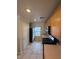 Bright kitchen with wood cabinets, laminate countertops, and modern stainless steel appliances at 1144 Black Cherry St, Las Vegas, NV 89142