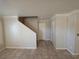 Open-concept living space featuring staircase and tile flooring at 1144 Black Cherry St, Las Vegas, NV 89142
