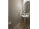 This traditional powder room features a pedestal sink, decorative mirror, and standard fixtures, offering a simple design at 1144 Black Cherry St, Las Vegas, NV 89142