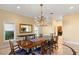 Dining room features custom lighting, marble floors, and seating for eight at 1234 Campbell Dr, Las Vegas, NV 89102