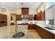 Gourmet kitchen with island, stainless steel appliances, modern lighting, and ample counter space at 1234 Campbell Dr, Las Vegas, NV 89102