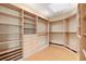 Well-organized walk-in closet with custom shelving, drawers, and ample storage space at 1234 Campbell Dr, Las Vegas, NV 89102
