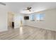 Bedroom with balcony access and beautiful mountain views through large windows at 12524 Skylight View St, Las Vegas, NV 89138
