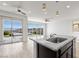 Bright modern kitchen with granite countertops, stainless steel appliances, and views of the backyard at 12524 Skylight View St, Las Vegas, NV 89138