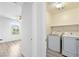 Convenient laundry room setup with modern appliances and ample space at 12524 Skylight View St, Las Vegas, NV 89138