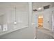 Bright hallway with light fixture, and a view to the bath at 1604 Tamborine Ct, Las Vegas, NV 89128