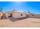 Enclosed backyard with gravel and brick patio, ideal for outdoor activities and relaxation at 1900 Cameron St, Las Vegas, NV 89102