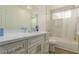 Bright bathroom with marble backsplash, vanity with plenty of storage space, and a bathtub at 1900 Cameron St, Las Vegas, NV 89102