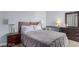 Well-lit bedroom with a bed, a desk, and a dresser with mirror at 1900 Cameron St, Las Vegas, NV 89102