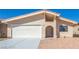Inviting single-story home with a well-maintained front yard and two-car garage at 1900 Cameron St, Las Vegas, NV 89102
