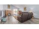 Cozy living room featuring a brick fireplace, neutral decor, and sliding glass door at 1900 Cameron St, Las Vegas, NV 89102