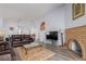 Spacious living room with a decorative fireplace, TV, and comfortable seating area at 1900 Cameron St, Las Vegas, NV 89102