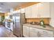 Kitchen showcases sleek, stainless steel refrigerator and range with plenty of cabinet space and attractive counters at 216 Biscotti Ave # Lot 126, North Las Vegas, NV 89084