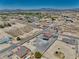 This elevated shot features a private desert home with an inviting pool, surrounded by open land and distant mountains at 2171 Deadwood St, Pahrump, NV 89048