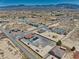 Desert neighborhood aerial view features a private home with red tile roof, backyard pool and spacious lot at 2171 Deadwood St, Pahrump, NV 89048