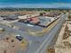 Aerial view showcasing a desert property with a charming red-roofed home and ample space for outdoor living at 2171 Deadwood St, Pahrump, NV 89048