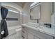 Modern bathroom with a tub and shower, stylish vanity, and contemporary fixtures at 2171 Deadwood St, Pahrump, NV 89048