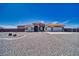 Charming home featuring a tile roof, desert landscaping, and an attached three car garage at 2171 Deadwood St, Pahrump, NV 89048