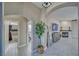 Inviting hallway featuring archways that lead to the bathroom and living room, complete with stylish floors at 2171 Deadwood St, Pahrump, NV 89048