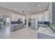 Beautiful kitchen with white upper cabinets, gray lower cabinets, and stainless steel appliances at 2171 Deadwood St, Pahrump, NV 89048