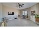 Inviting living room with tile floors, built in cabinets, and a ceiling fan at 2171 Deadwood St, Pahrump, NV 89048