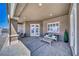 Covered patio area with comfortable seating and views of the surrounding landscape at 2171 Deadwood St, Pahrump, NV 89048
