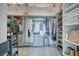 Organized walk-in closet with shelving, drawers, and hanging space, providing ample storage for clothing and accessories at 2171 Deadwood St, Pahrump, NV 89048