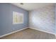 Cozy bedroom features a brick accent wall and a window providing natural light at 224 Devotion Ct, Henderson, NV 89052