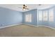 Bright bedroom showcasing neutral decor, a ceiling fan, and plantation shutters at 224 Devotion Ct, Henderson, NV 89052