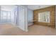 Bedroom offering ample natural light, built-in desk, and stone accent wall at 224 Devotion Ct, Henderson, NV 89052