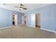 Spacious bedroom features blue walls, carpet, and large closet space at 224 Devotion Ct, Henderson, NV 89052