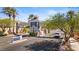 Community gatehouse featuring elegant architectural details and lush landscaping at 224 Devotion Ct, Henderson, NV 89052