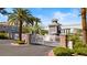 Gated community entrance featuring stone accents, mature landscaping, and secure access at 224 Devotion Ct, Henderson, NV 89052