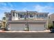 Two-story townhome features a two-car garage and classic architectural details at 224 Devotion Ct, Henderson, NV 89052